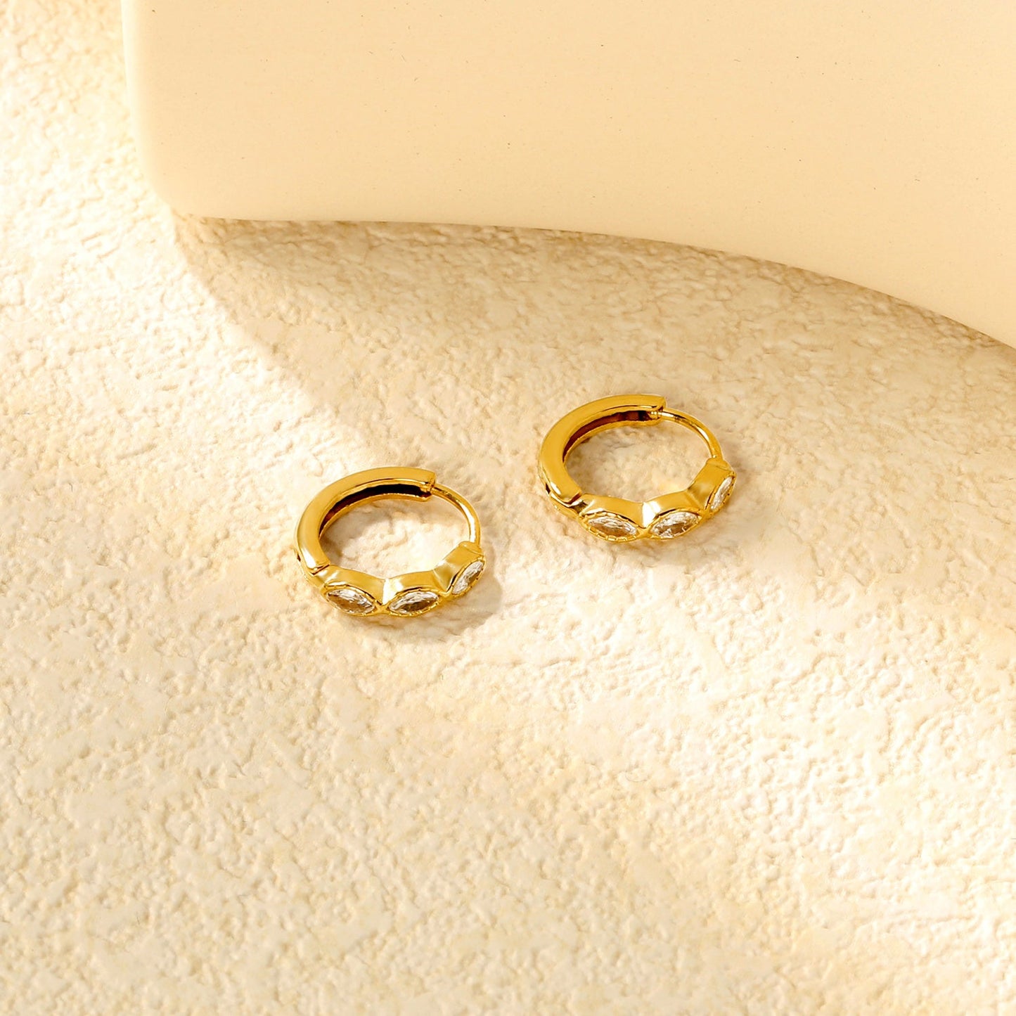 2.9 x 12mm three oval-shaped white zirconia earrings with 2.2 x 10mm inner diameter ear hooks, gold color