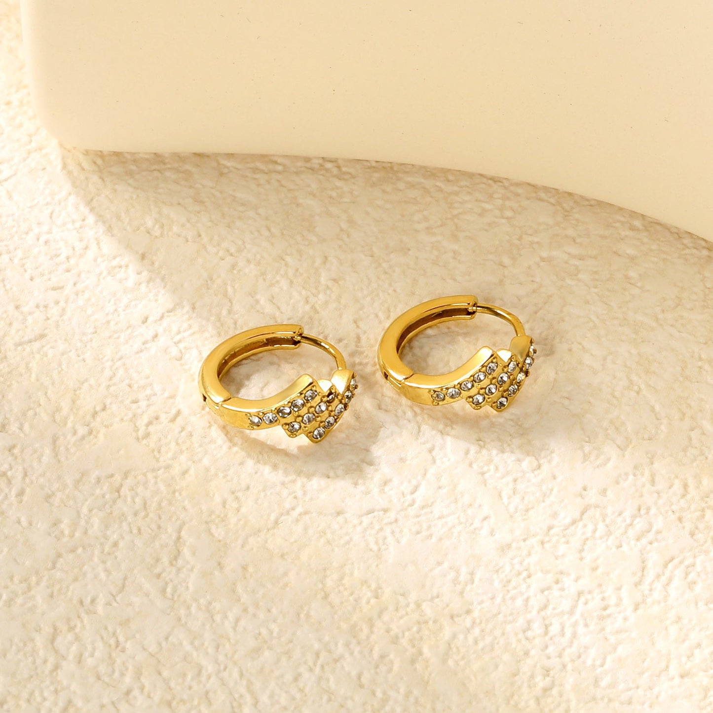 6.4 x 10.9mm diagonal rectangular white zirconia stud earrings with 2.2mm post and 10mm inner diameter, gold-plated