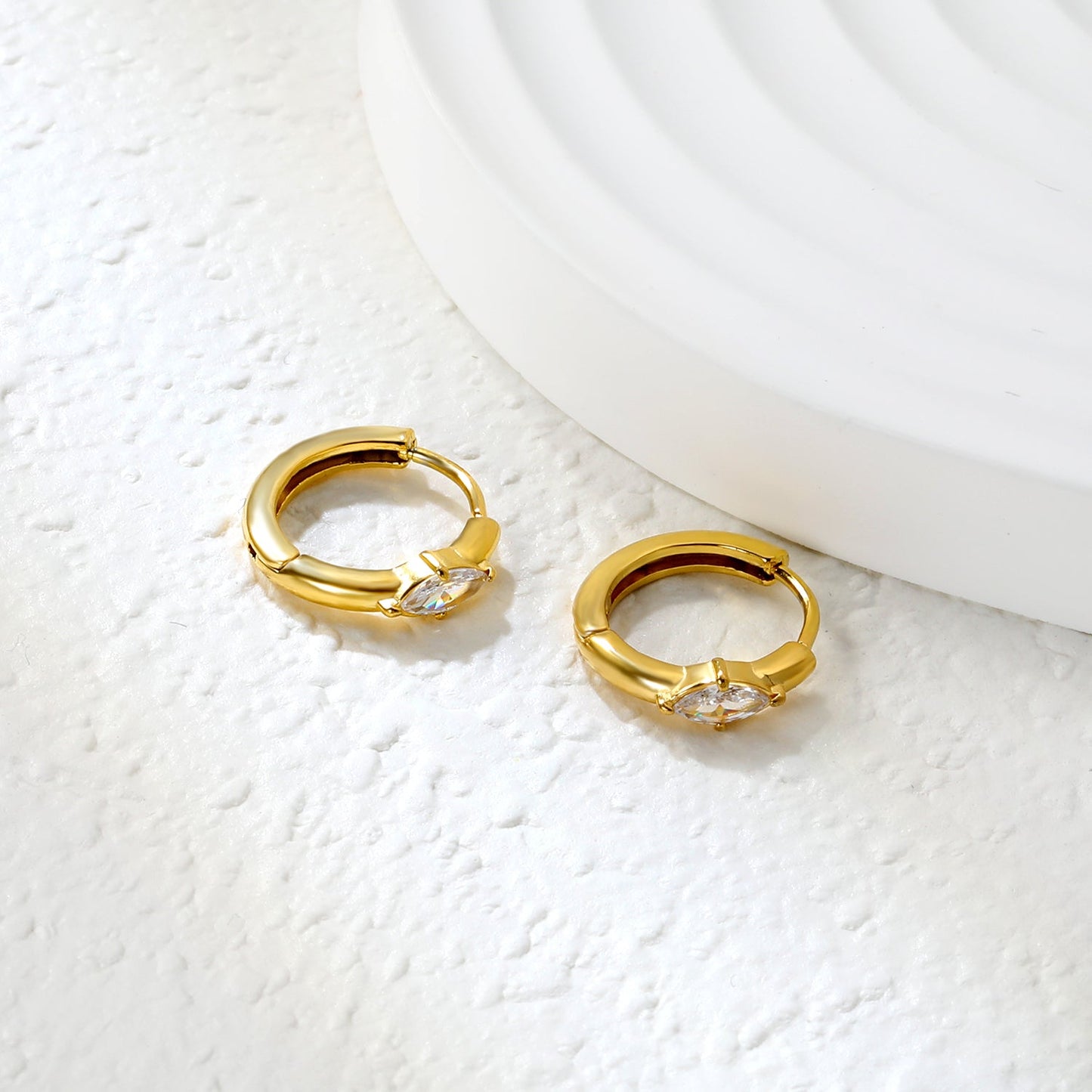 3.7 x 6.7mm diamond-shaped white zirconia stud earrings with a 2.2mm post and a 10mm inner diameter, gold-colored