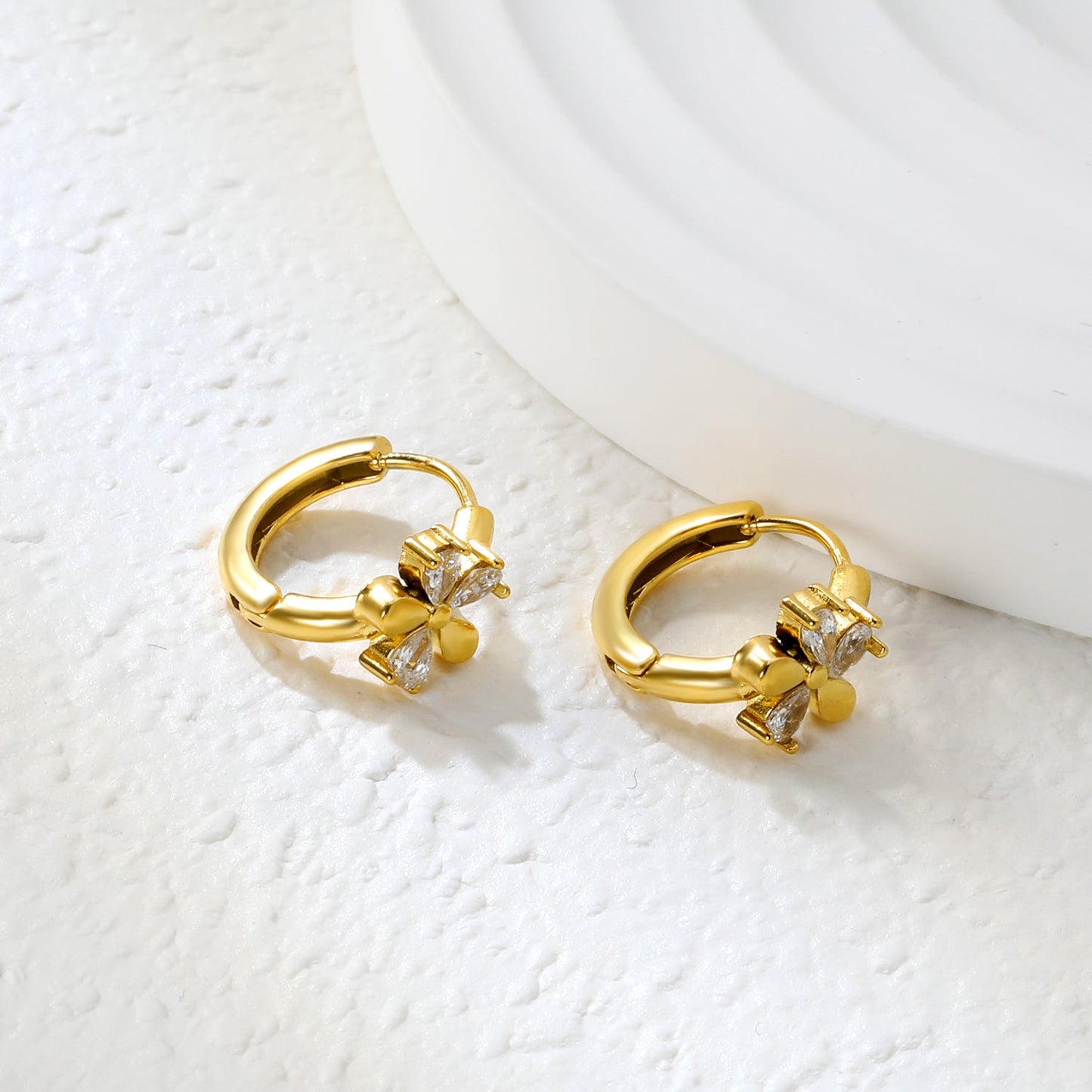 8mm flower-shaped earring with three white zirconia stones, 2.2mm post, and a 10mm inner diameter, gold color