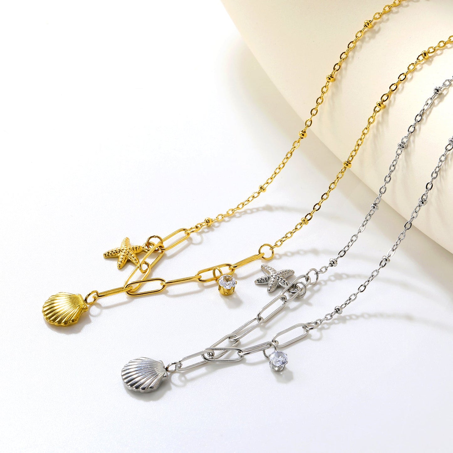 10.2*10.7mm shell+9*12.7mm starfish+4.2mm cylindrical white diamonds 42+5cm+10*3cm necklace steel/golden