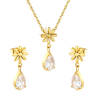 Flower + drop white diamond set Steel / Gold Earrings: 8.3mm flower + 6.2*10mm drop white diamond Pendant: 8.9mm flower + 6.2*10mm drop white diamond 0.3 Cross chain 42+5cm+6mm round plate