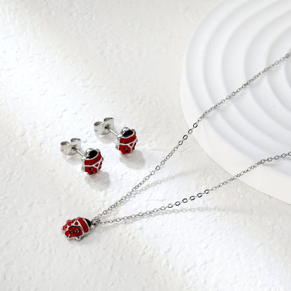 Seven star ladybug set Steel color/golden earrings: 7.3*8.2mm Pendant: 7.3*8.8mm0.3 Cross chain 40+5cm+6mm round plate