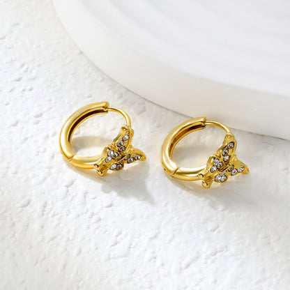10.3 x 8.8mm butterfly-shaped white zirconia earring with a 2.2mm earring post and a 10mm inner diameter, gold-colored